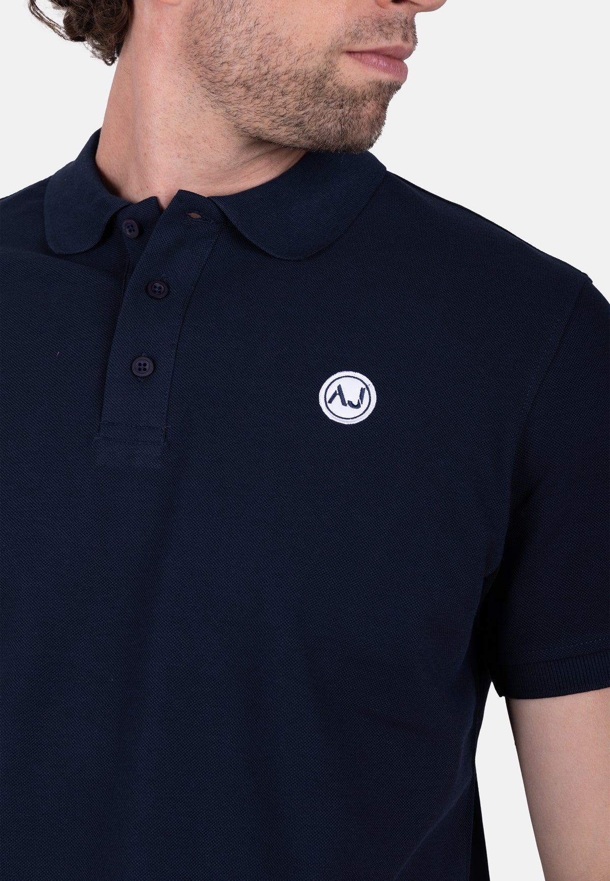 Polo piqué  marino con bordado logo amaro