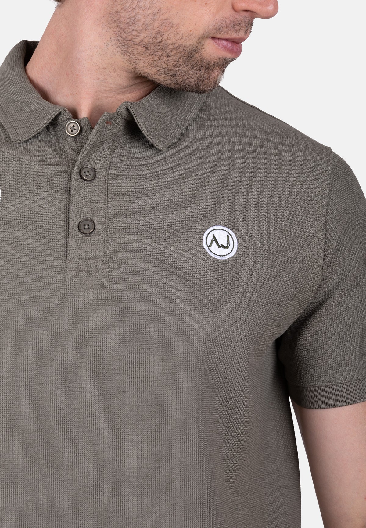 Polo piqué verde con bordado logo amaro